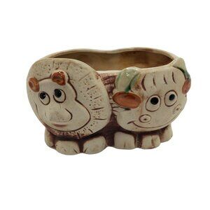 Vintage comical clay pottery lion and cow succulant planter.